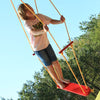 Child playing on red Wind Surfer board Swing with yellow rope