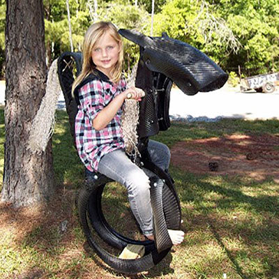 Child on Classic Pony Tire Swing 