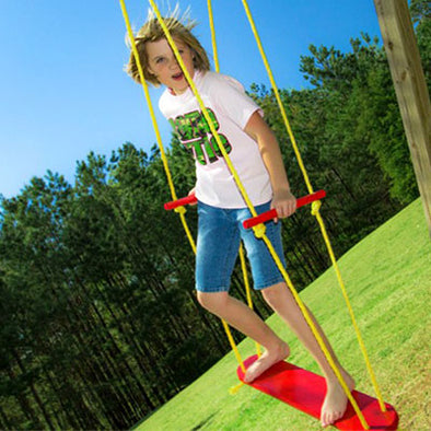 Child playing on red Wind Surfer board Swing with yellow rope